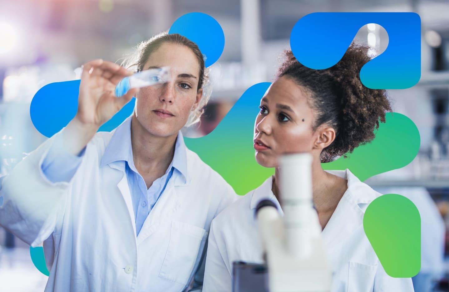 Two scientists examining a test tube