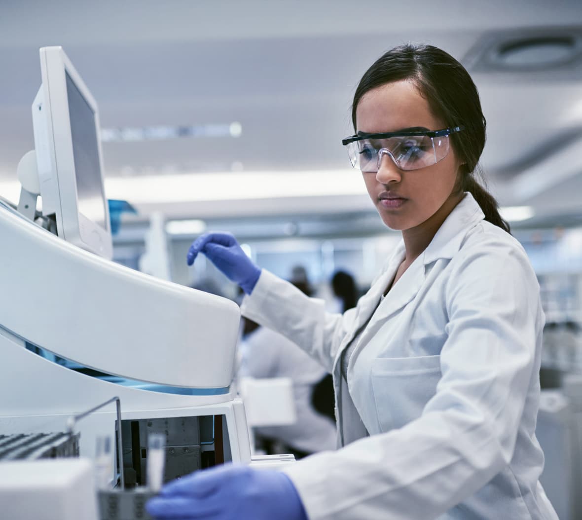 Female scientist working at laboratory equipment